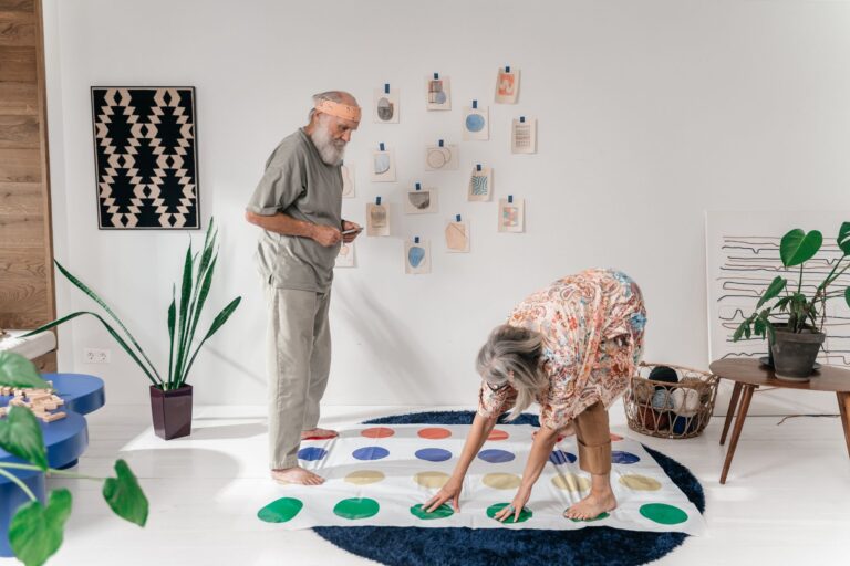 A senior couple having fun playing a board game indoors, promoting leisure and connection.